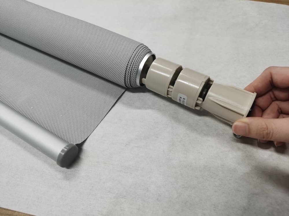 What is the spring mechanism of a cordless roller shades?